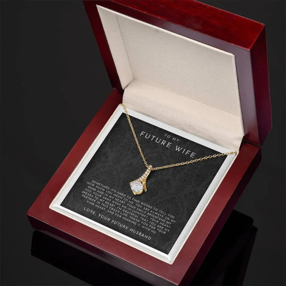 Gold necklace with sparkling pendant in wooden gift box, message card to future wife from husband