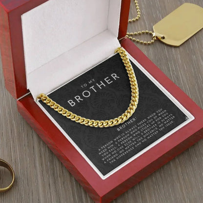 Gold chain bracelet in red gift box with heartfelt 'To My Brother' message card on wooden table