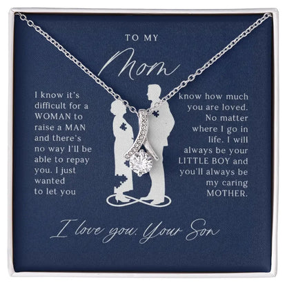 Silver necklace with a sparkling pendant on a navy card with a son's heartfelt message to mom
