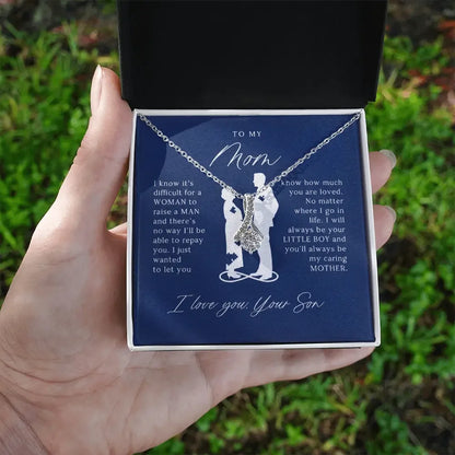 Silver necklace in gift box with sentimental message from son to mom, outdoors background