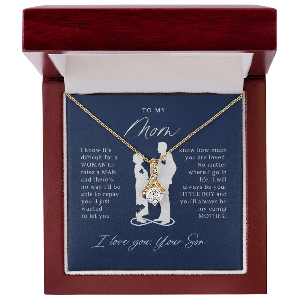 Gold and diamond pendant necklace in a wooden gift box with a heartfelt message from son to mom