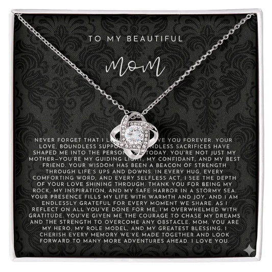 Silver sparkling knot necklace with diamond pendant on black card reading To My Beautiful Mom message